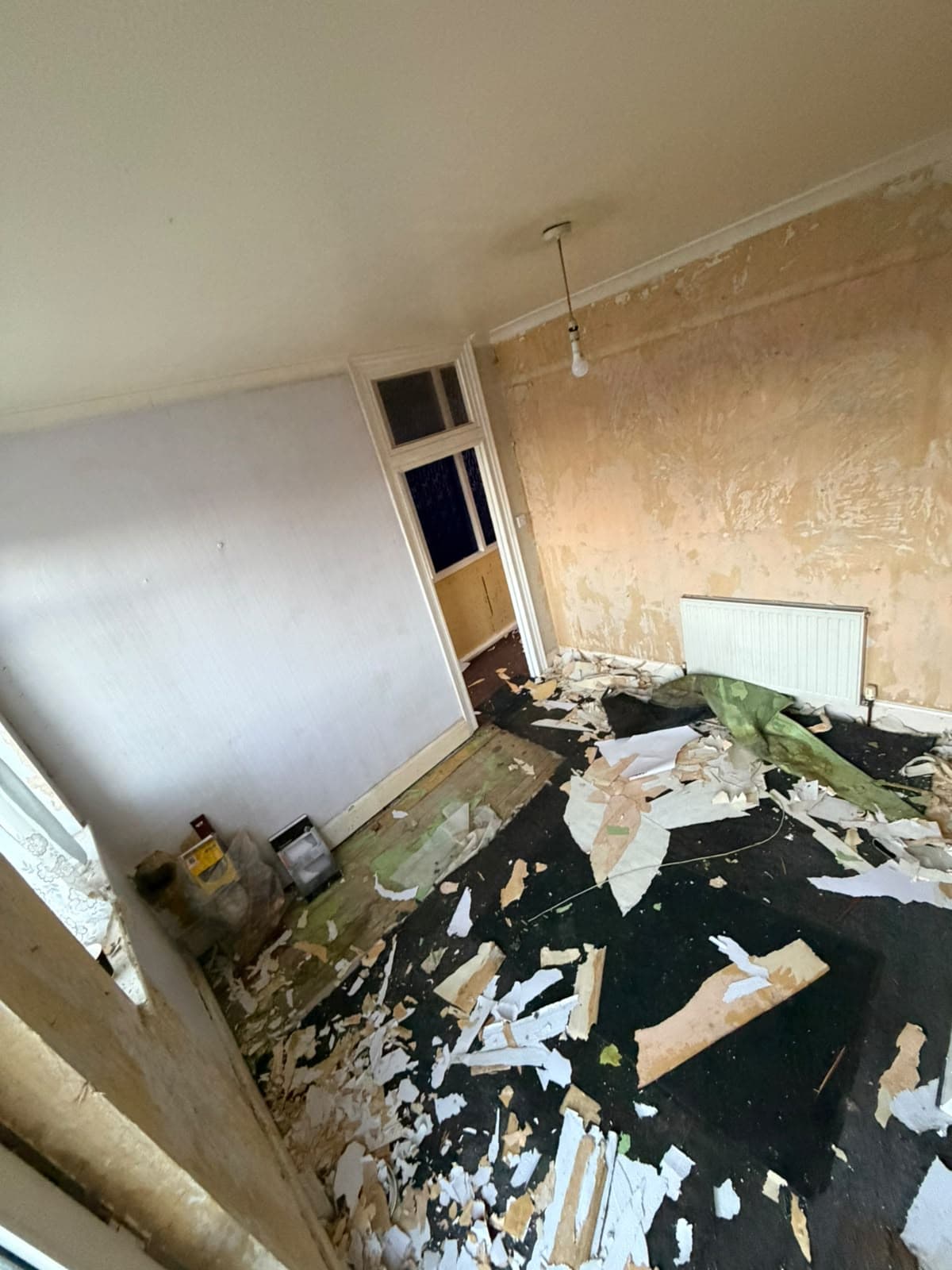 Hampden Square before works: room with stripped finishes