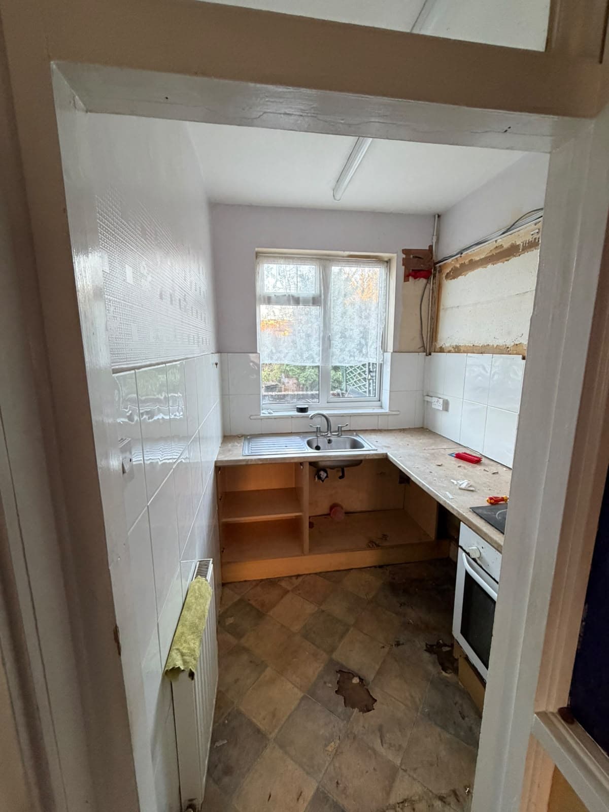 Hampden Square before works: kitchen and entrance