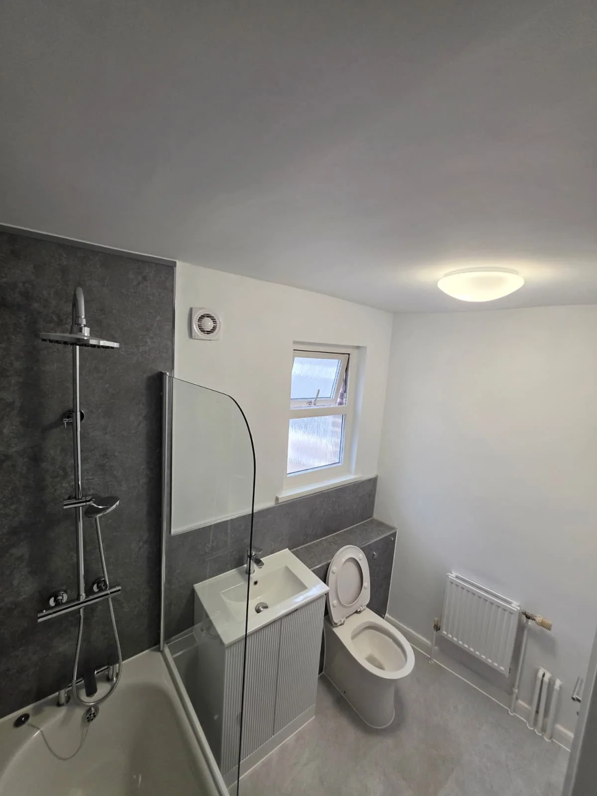 Bathroom vanity, mirror and towel radiator at Lancaster Road